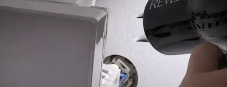 How do I unstick my ice maker arm?